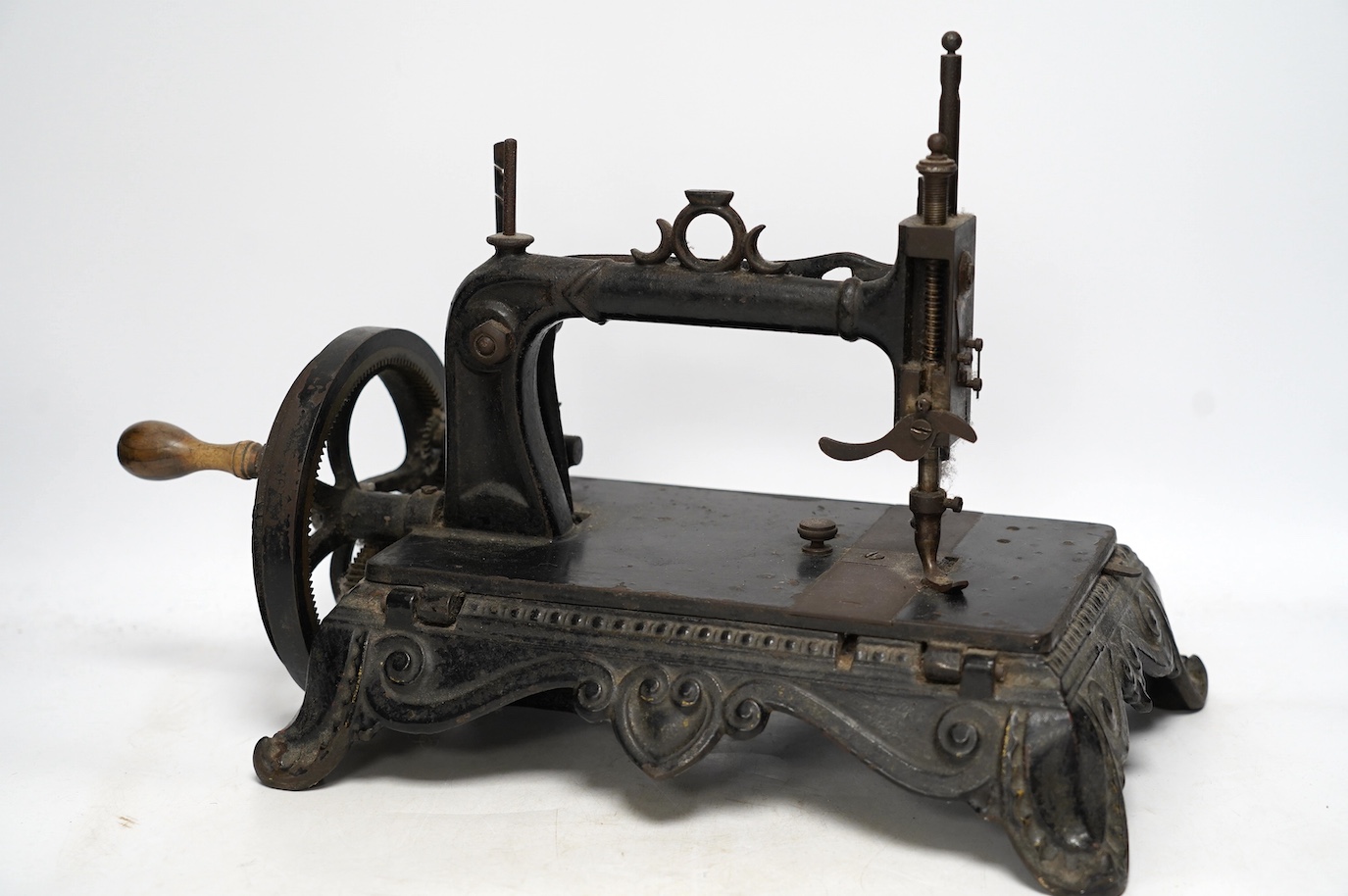 A late 19th century Atlas Brunonia sewing machine with decorative cast iron base. Condition - fair